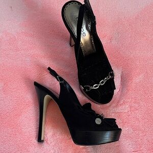 Black Shoes, BEBE Sling back High Heels with Chain and Fringe Detail.
Leather